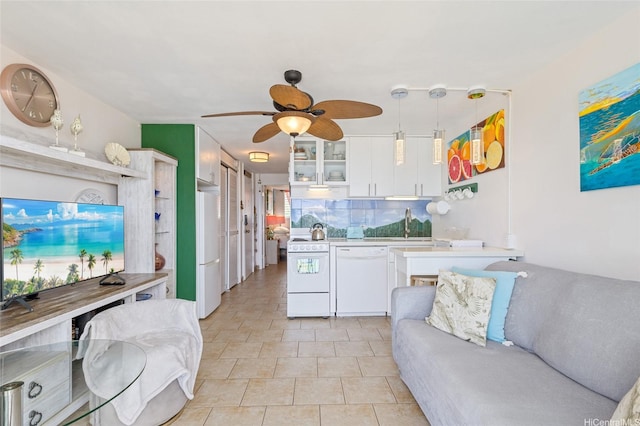 85-175 Farrington Hwy Unit A402, Waianae, HI 96792 - kitchen with white appliances, light countertops, white cabinets, glass insert cabinets, and a ceiling fan