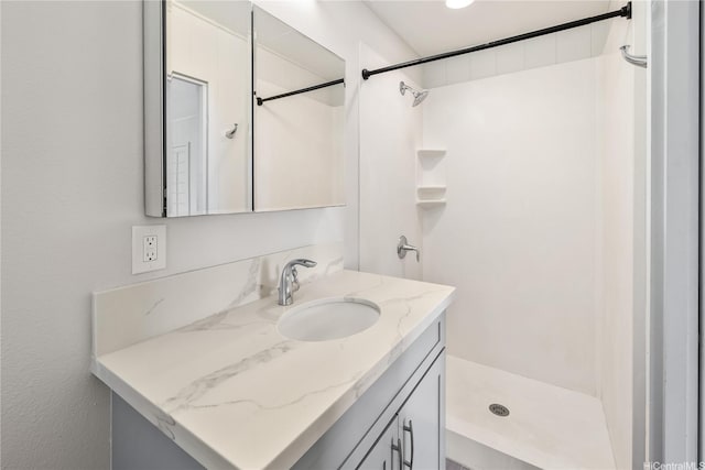bathroom featuring vanity and walk in shower