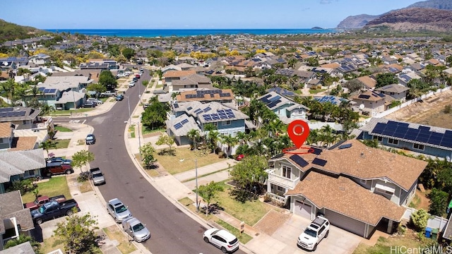 birds eye view of property with a mountain view and a residential view