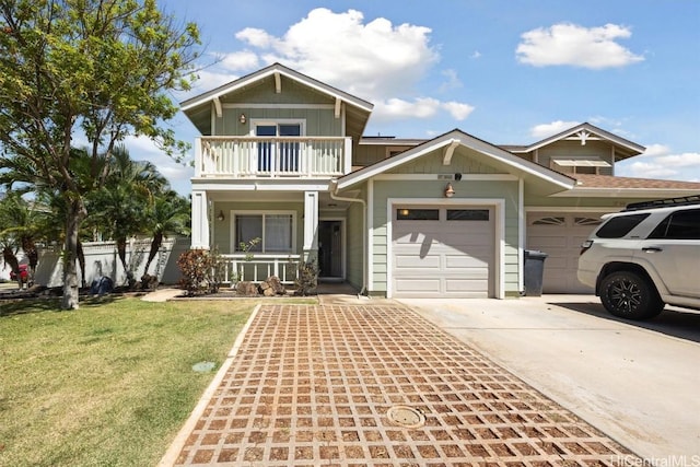 view of front of house featuring a balcony, driveway, a front lawn, an attached garage, and covered porch