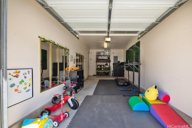 interior space with a garage door opener and electric panel
