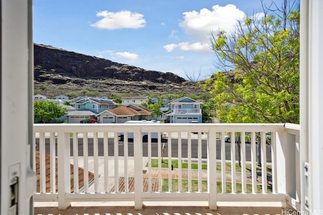 balcony featuring a mountain view and a residential view