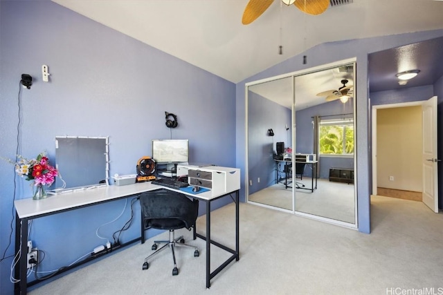 office area featuring light colored carpet, a ceiling fan, and lofted ceiling