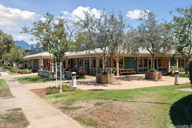 back of property with a yard