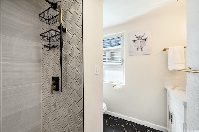222 Kaiulani Ave Unit 208, Honolulu, HI 96815 - bathroom with tile patterned flooring, vanity, baseboards, toilet, and tiled shower