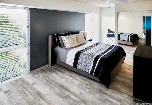 430 Keoniana St Unit 112, Honolulu, HI 96815 - bedroom featuring wood finished floors, a closet, and ceiling fan