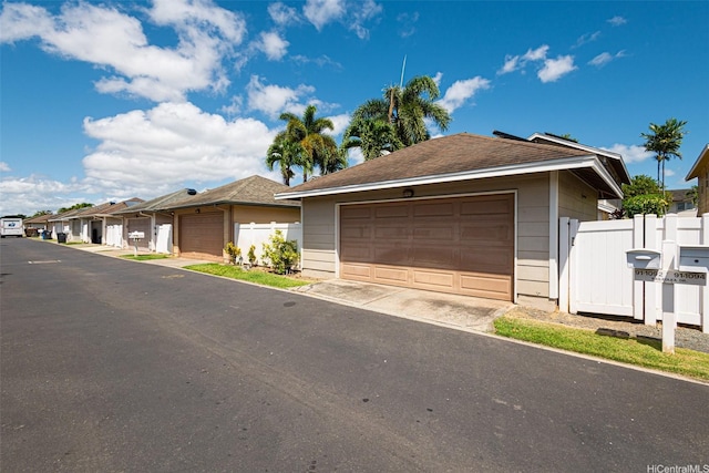 91-1092 Kaileolea Dr, Ewa Beach, HI 96706 - ranch-style home with a detached garage, a residential view, and roof with shingles