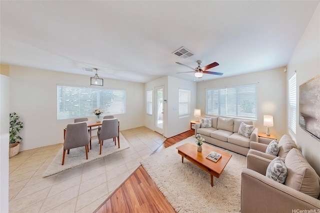 91-1092 Kaileolea Dr, Ewa Beach, HI 96706 - living room with light tile patterned flooring and a ceiling fan