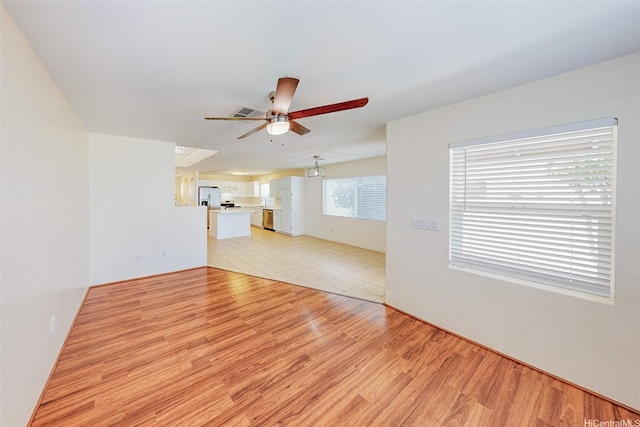 91-1092 Kaileolea Dr, Ewa Beach, HI 96706 - unfurnished living room with ceiling fan and light wood-type flooring