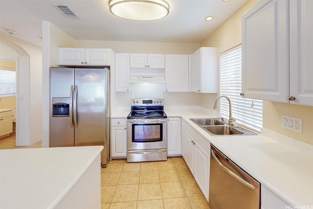 91-1092 Kaileolea Dr, Ewa Beach, HI 96706 - kitchen with stainless steel appliances, plenty of natural light, white cabinets, light countertops, and recessed lighting