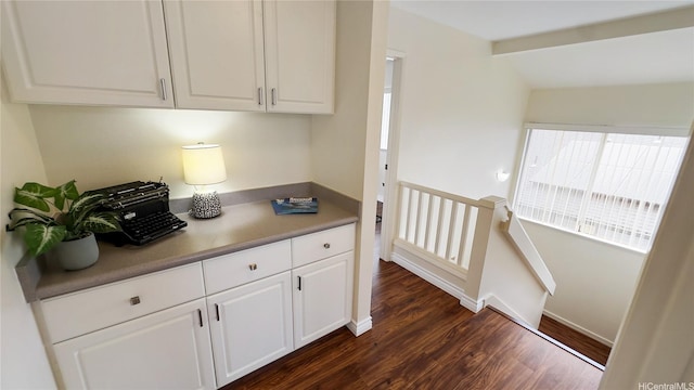 kitchen featuring white cabinets and dark wood finished floors