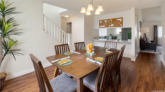 dining room with stairway, baseboards, an inviting chandelier, and wood finished floors