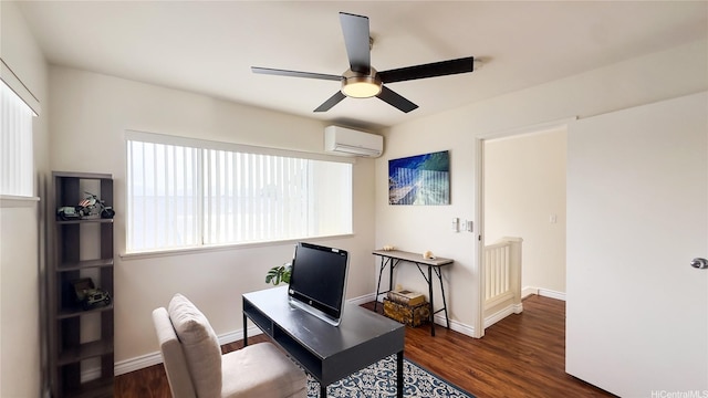 office with a wall mounted AC, wood finished floors, baseboards, and a ceiling fan