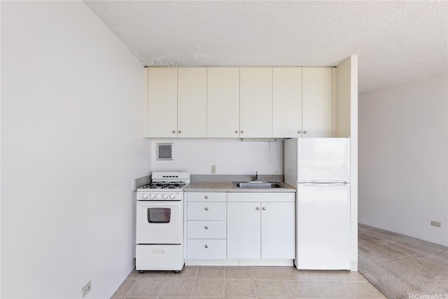 750 Amana St Unit 1111, Honolulu, HI 96814 - kitchen with light countertops, white appliances, a textured ceiling, and a sink