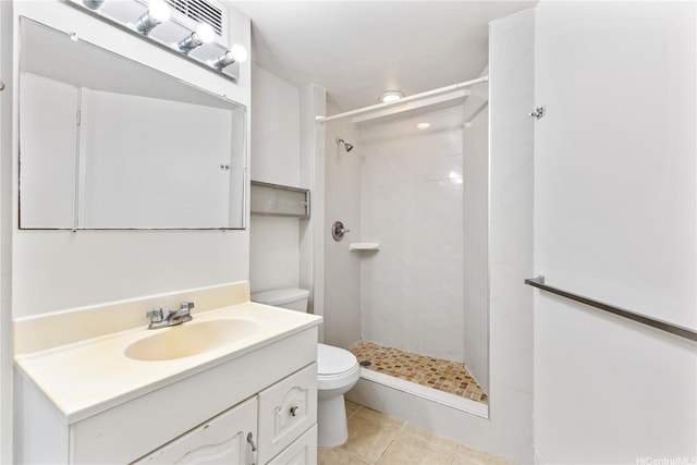750 Amana St Unit 1111, Honolulu, HI 96814 - full bath featuring vanity, tile patterned flooring, a tile shower, and toilet