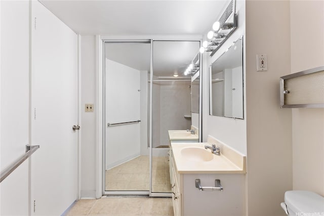 750 Amana St Unit 1111, Honolulu, HI 96814 - bathroom featuring vanity, tile patterned floors, walk in shower, and toilet