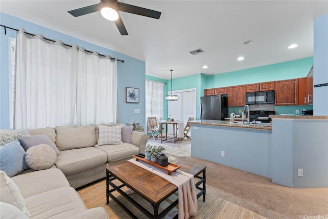 91-1001 Keaunui Dr Unit 35, Ewa Beach, HI 96706 - living room with a ceiling fan, light colored carpet, and recessed lighting