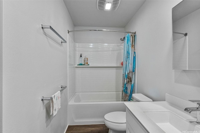 bathroom featuring toilet, vanity, shower / bathtub combination with curtain, and wood finished floors