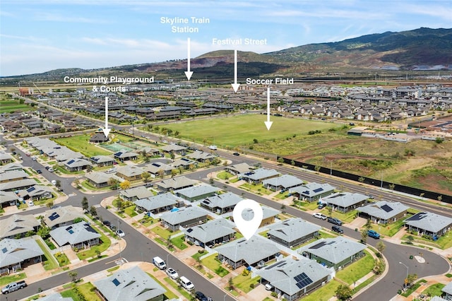 birds eye view of property with a mountain view and a residential view