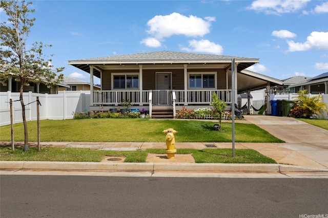 view of front of home featuring a porch, fence, driveway, a front yard, and a carport