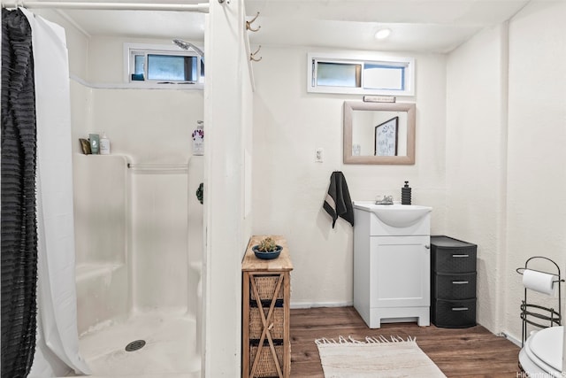 54-266 Kawaihemo Pl, Hauula, HI 96717 - full bath featuring vanity, a shower stall, wood finished floors, and baseboards