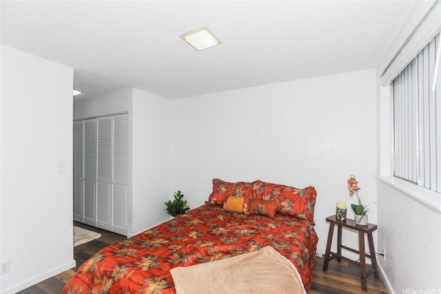 bedroom with wood finished floors and baseboards
