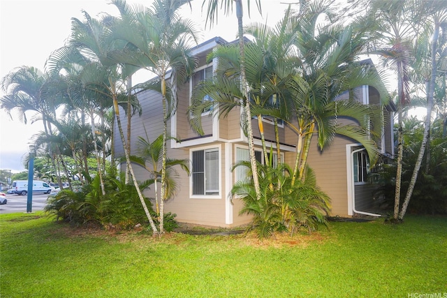 view of home's exterior featuring a yard