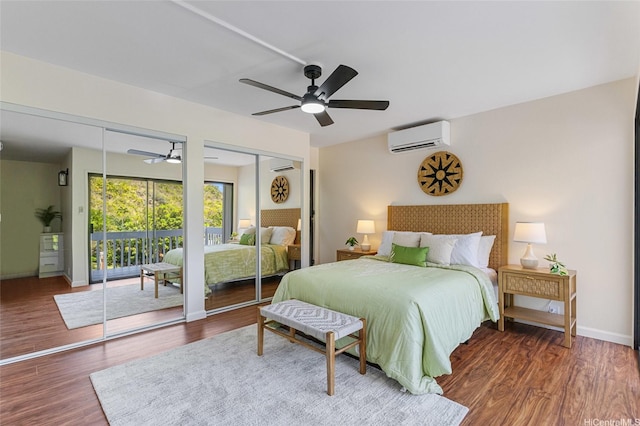 1623 Kalaniuka Way Unit 43, Honolulu, HI 96821 - bedroom featuring a wall unit AC, multiple closets, wood finished floors, and a ceiling fan