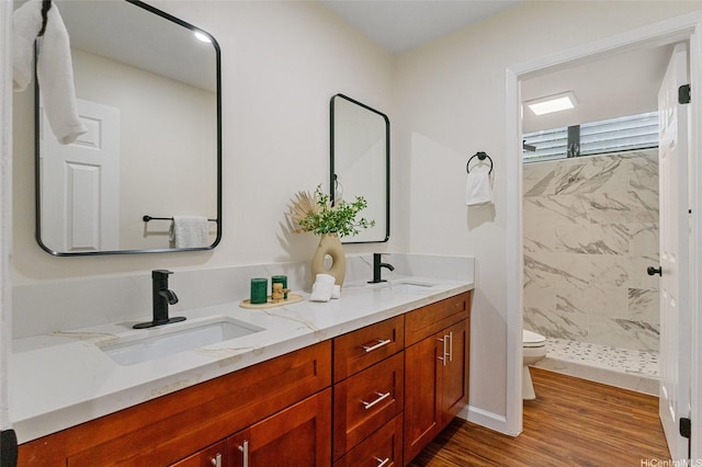 1623 Kalaniuka Way Unit 43, Honolulu, HI 96821 - full bathroom featuring double vanity, a stall shower, and wood finished floors