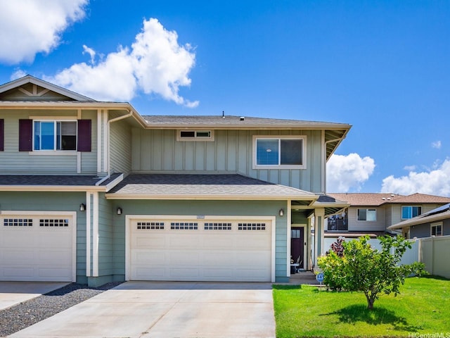 91-1483 Loiloi Loop, Ewa Beach, HI 96706 - view of front facade featuring board and batten siding, an attached garage, and concrete driveway