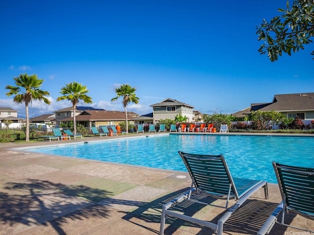 91-1483 Loiloi Loop, Ewa Beach, HI 96706 - community pool featuring a patio, fence, and a residential view