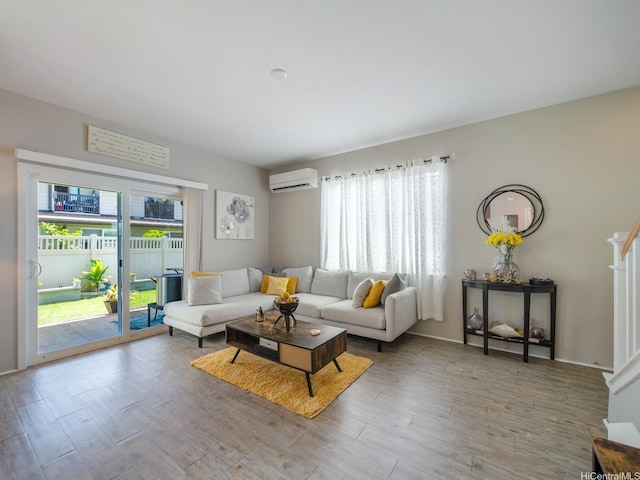 91-1483 Loiloi Loop, Ewa Beach, HI 96706 - living area with a wall mounted AC, healthy amount of natural light, and wood finished floors