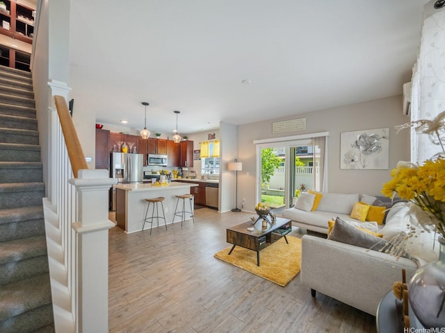 91-1483 Loiloi Loop, Ewa Beach, HI 96706 - living room with light wood-style floors, stairs, and recessed lighting