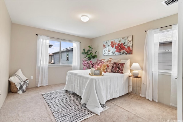 bedroom featuring visible vents and carpet flooring