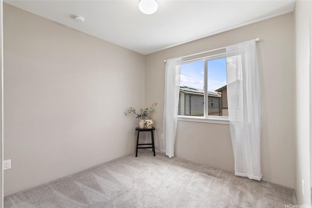 spare room featuring carpet flooring