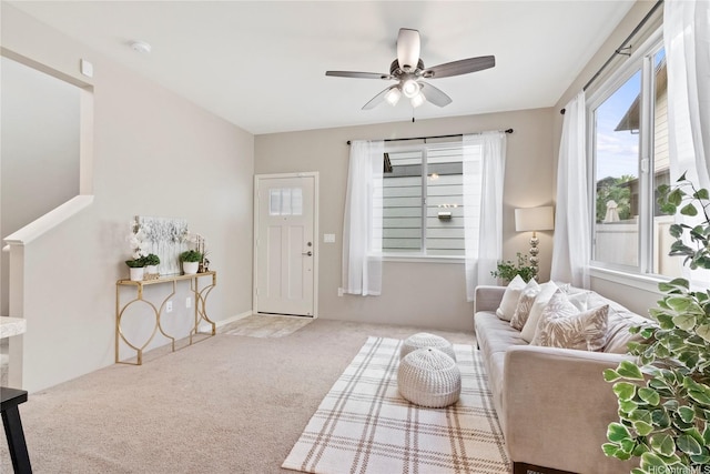 living room with carpet and a ceiling fan