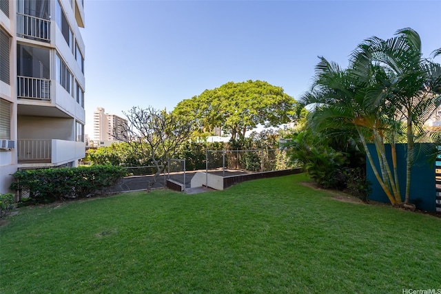 1031 Ala Napunani St Unit 401, Honolulu, HI 96818 - view of yard featuring a garden and cooling unit