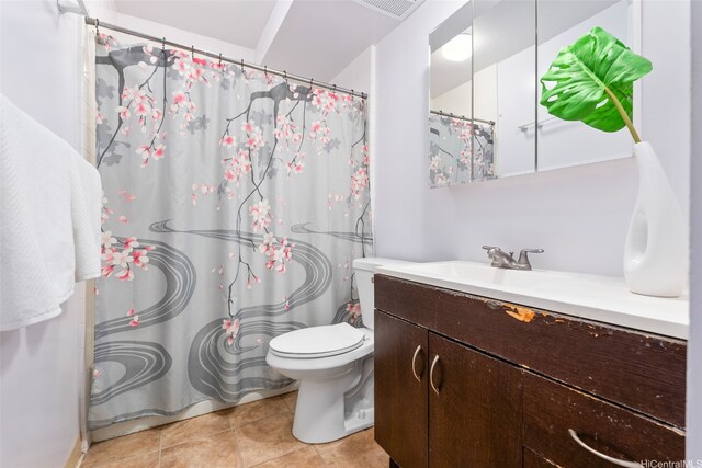 1031 Ala Napunani St Unit 401, Honolulu, HI 96818 - bathroom with a shower with shower curtain, toilet, vanity, and tile patterned floors