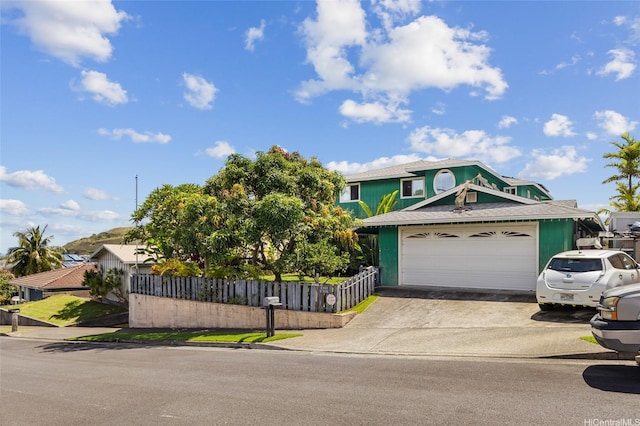 1315 Onioni St, Kailua, HI 96734 - view of front of property with concrete driveway and a garage