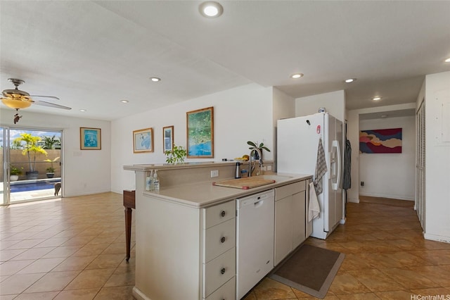 1315 Onioni St, Kailua, HI 96734 - kitchen with white appliances, white cabinetry, a breakfast bar area, recessed lighting, and light countertops