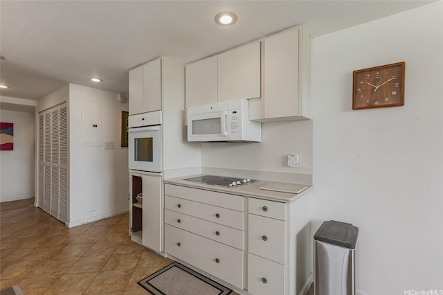 1315 Onioni St, Kailua, HI 96734 - kitchen with white appliances, light countertops, white cabinets, recessed lighting, and baseboards