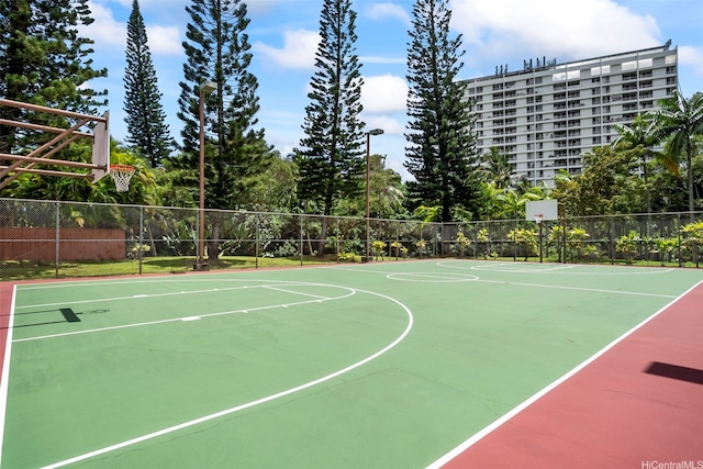 view of basketball court with fence and community basketball court