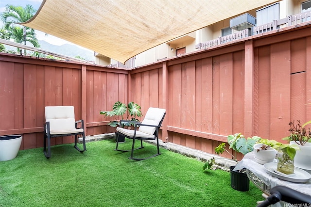 view of yard with fence and a mountain view
