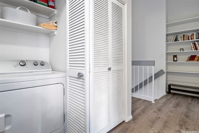 laundry room featuring laundry area, washer / clothes dryer, and wood finished floors