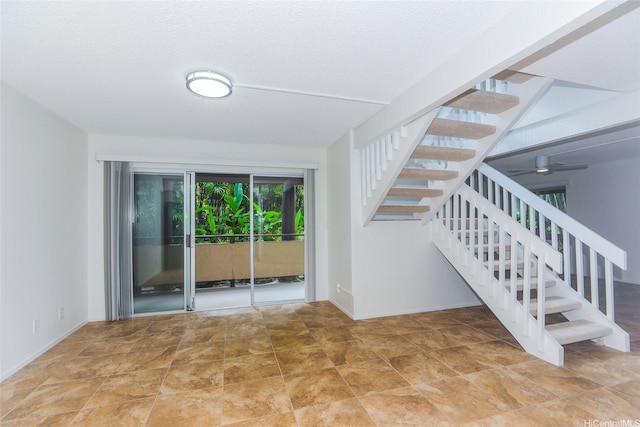 46-318 Haiku Rd Unit 70, Kaneohe, HI 96744 - stairway featuring a textured ceiling