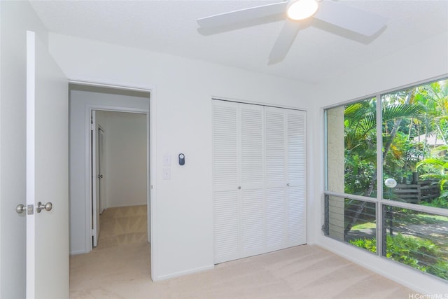 46-318 Haiku Rd Unit 70, Kaneohe, HI 96744 - unfurnished bedroom featuring light carpet, a closet, and ceiling fan