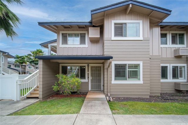 91-1039 Kamaaha Ave Unit 1505, Kapolei, HI 96707 - view of front of property featuring board and batten siding