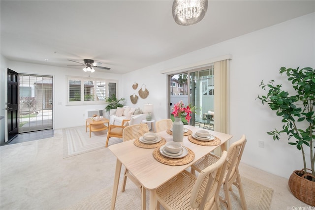 91-1039 Kamaaha Ave Unit 1505, Kapolei, HI 96707 - carpeted dining room with a ceiling fan and a chandelier