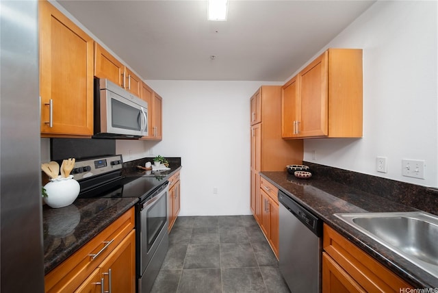 91-1039 Kamaaha Ave Unit 1505, Kapolei, HI 96707 - kitchen featuring appliances with stainless steel finishes and dark stone counters