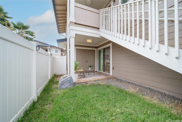 91-1039 Kamaaha Ave Unit 1505, Kapolei, HI 96707 - view of exterior entry with a balcony and a patio area